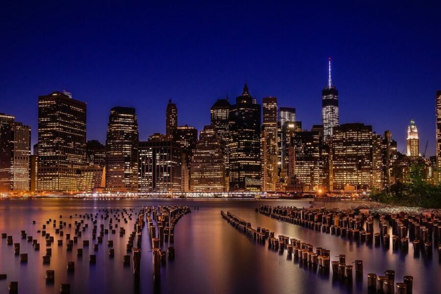 New York City: Night Skyline Bus Tour with Pizza Slice - Transportation, Group Feel, and Weather Reality at Night
