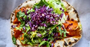 NYC: Greenwich Village Food Tour with 6 Authentic Tastings - Bagel and schmear: your first bite is pure New York
