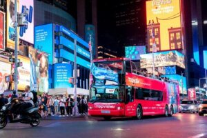 Skyline Night Bus Audio Narrated Tour Experience - Boarding at 620 7th Ave: seats, upper deck, and timing