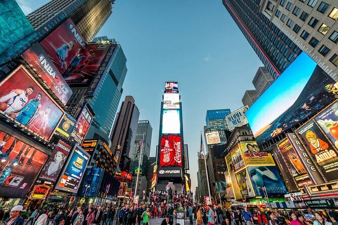Skyline Night Bus Audio Narrated Tour Experience - Rockefeller Center and the neon-photo entertainment stop